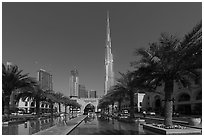 Model and Burj Khalifa from reflecting pool. United Arab Emirates ( black and white)