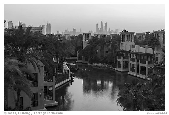 Medina Jumerah lush gardens and city skyline. United Arab Emirates (black and white)