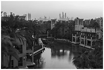 Medina Jumerah lush gardens and city skyline. United Arab Emirates ( black and white)