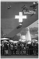 Visitors with umbrellas, Swizerland Pavilion. Expo 2020, Dubai, United Arab Emirates ( black and white)