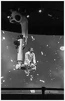 Man performing with robotic arm, Kazakhstan Pavilion. Expo 2020, Dubai, United Arab Emirates ( black and white)