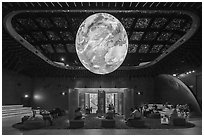 Visitors watch horizontal media show, USA Pavilion. Expo 2020, Dubai, United Arab Emirates ( black and white)