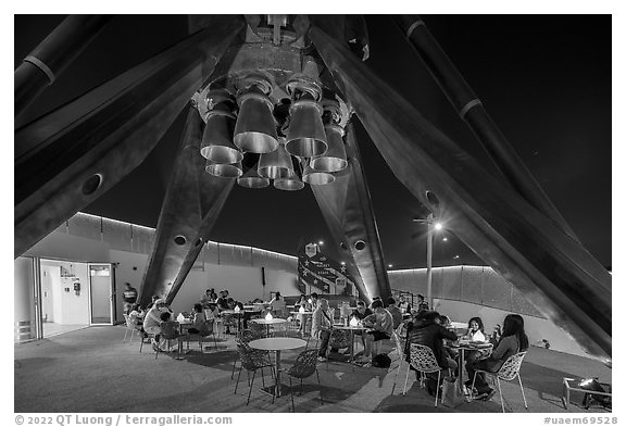 Rocket Garden below the landing legs of Falcon 9 rocket at night, USA Pavilion. Expo 2020, Dubai, United Arab Emirates (black and white)