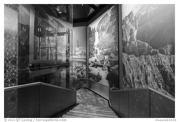 Stars motif, elevator, mural photos of national parks, USA Pavilion. Expo 2020, Dubai, United Arab Emirates (black and white)