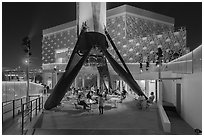 Booster rocket on landing legs and pavilion, USA Pavilion. Expo 2020, Dubai, United Arab Emirates ( black and white)