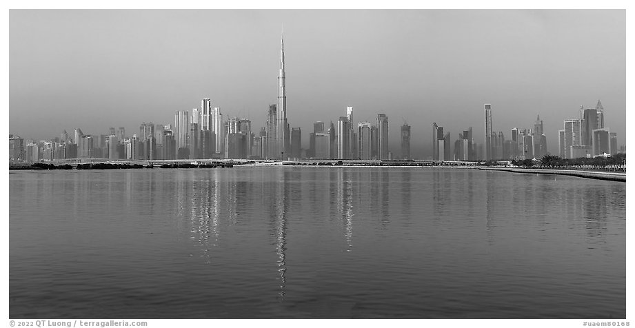 Downtown Dubai skyline with reflections in Dubai Creek. United Arab Emirates (black and white)