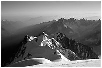 Mount Maudit, Mont-Blanc du Tacul and Aiguille du Midi seen from summit of Mont-Blanc, France. (black and white)