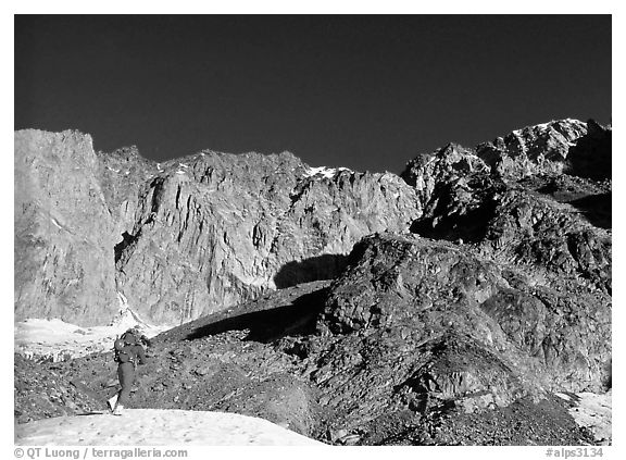 Alpinist approaching the Freney Pillars, Mont-Blanc, Italy.