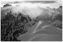 Alpinists on the Aiguille du Midi ridge. Alps, France (black and white)