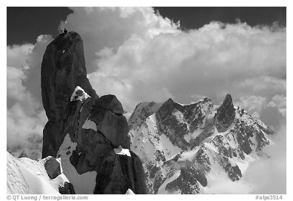 Alpinists on a pinacle of Aiguille du Midi after climbing the South Face. Alps, France