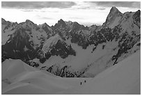 Alpinists climb Aiguille du Midi, France. (black and white)