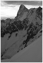 Alpinists climb Aiguille du Midi, France. (black and white)