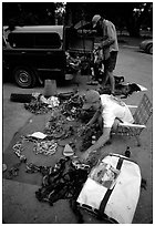 Climbers sort gear for a big-wall climb on the camp 4 parking lot. Yosemite, California (black and white)