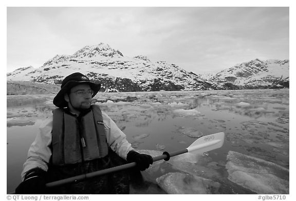 Kayaker on ice-chocked waters close to John Hopkins Inlet. Glacier Bay National Park, Alaska