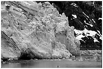 Kayaker dwarfed by Lamplugh Glacier. Glacier Bay National Park, Alaska (black and white)