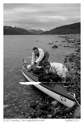 Kayaker packing tight into a double kayak. Glacier Bay National Park, Alaska