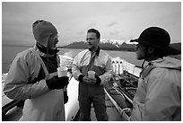 Kayakers in dry suits on the deck of Glacier Bay Lodge concession boat. Glacier Bay National Park, Alaska (black and white)