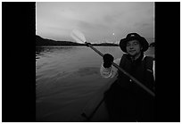 Kayaker paddling in Muir Inlet at midnight. Glacier Bay National Park, Alaska (black and white)