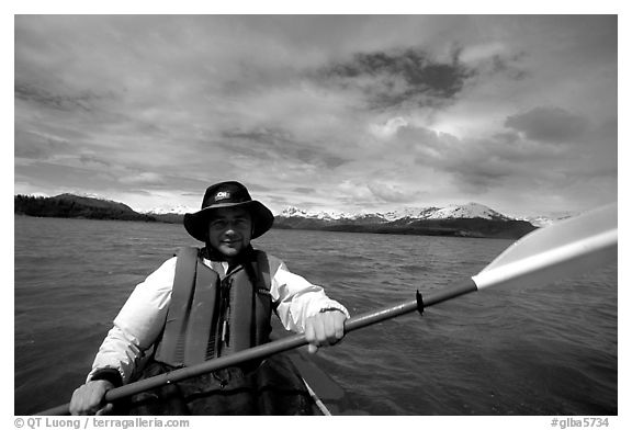 Kayaker paddling in Muir Inlet. Glacier Bay National Park, Alaska