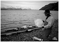 Kayaker looking at the map, East Arm. Glacier Bay National Park, Alaska (black and white)
