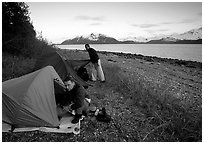 Kayakers getting into their tents for the night,  East Arm. Glacier Bay National Park, Alaska (black and white)