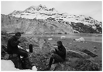 Eating in front of Lamplugh Glacier. Glacier Bay National Park, Alaska (black and white)