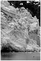 Kayaker dwarfed by Lamplugh Glacier. Glacier Bay National Park, Alaska (black and white)