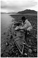 Kayaker unloading kayak. Glacier Bay National Park, Alaska (black and white)