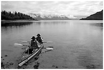 Kayakers land in Hugh Miller Inlet. Glacier Bay National Park, Alaska (black and white)