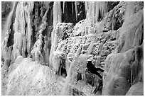 Rappeling from an ice climb in Provo Canyon, Utah. USA (black and white)