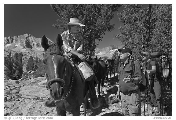 Horseman speaking with hikers, Dusy Basin. Kings Canyon National Park, California