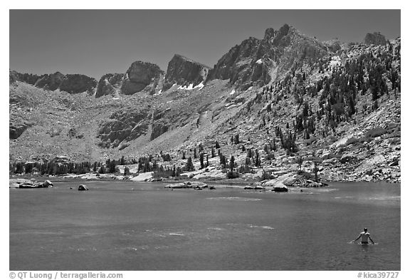 Man bathing in alpine lake, lower Dusy Basin. Kings Canyon National Park, California