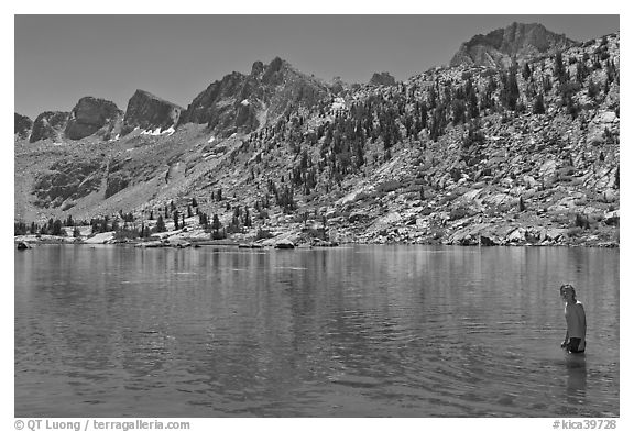 Young man in alpine lake, lower Dusy Basin. Kings Canyon National Park, California