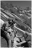 Men filming a waterfall, lower Dusy Basin. Kings Canyon National Park, California (black and white)