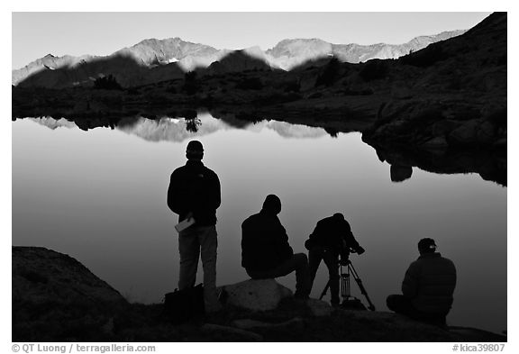 Film crew in action at lake, sunrise, Dusy Basin. Kings Canyon National Park, California