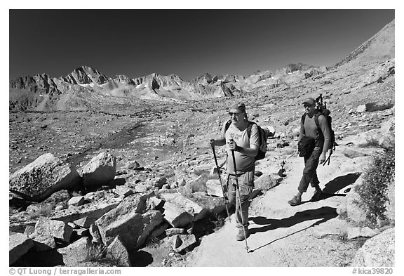 Hikers on trail below Biship Pass, Dusy Basin. Kings Canyon National Park, California