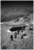 Backpackers near a tarn Lake. Kings Canyon National Park, California (black and white)