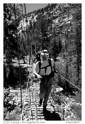 Crossing a river on a suspension bridge. Kings Canyon National Park, California