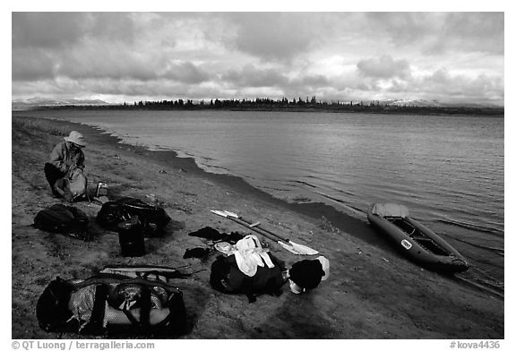 Canoeist packing the camping gear. Kobuk Valley National Park, Alaska