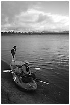 Canoeists ready to lauch with the boat loaded up. Kobuk Valley National Park, Alaska (black and white)