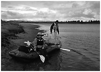Canoeists ready to lauch with the boat loaded up. Kobuk Valley National Park, Alaska (black and white)