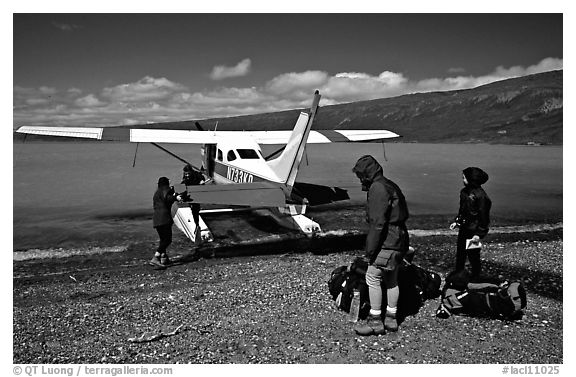 Backpackers dropped off by floatplane on Lake Turquoise. Lake Clark National Park, Alaska