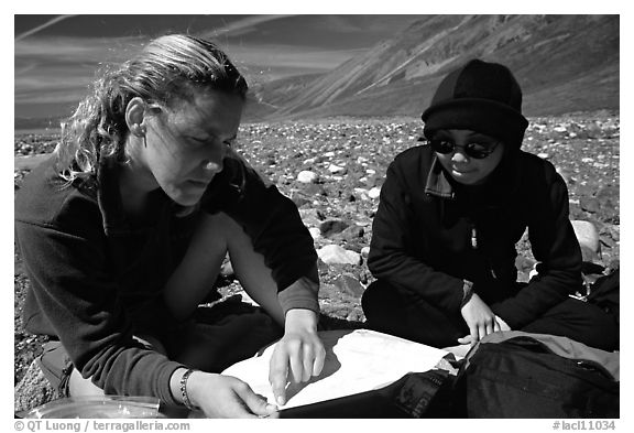 Women hikers consulting a map. Lake Clark National Park, Alaska