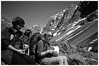 Women hikers pausing below the Telaquana Mountains. Lake Clark National Park, Alaska (black and white)