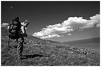 Backpacker looking at Turquoise Lake. Lake Clark National Park, Alaska (black and white)