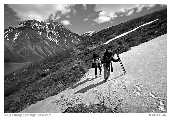 Backpackers crossing a neve. Lake Clark National Park, Alaska