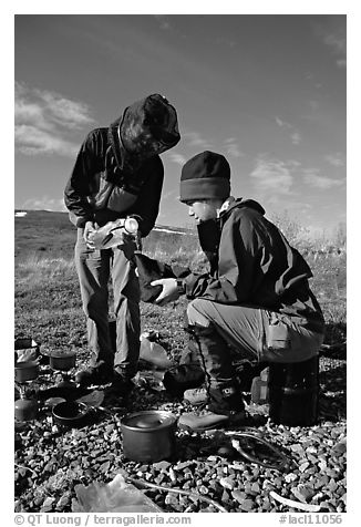 Backpackers transfering water. Lake Clark National Park, Alaska