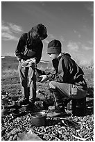 Backpackers transfering water. Lake Clark National Park, Alaska (black and white)