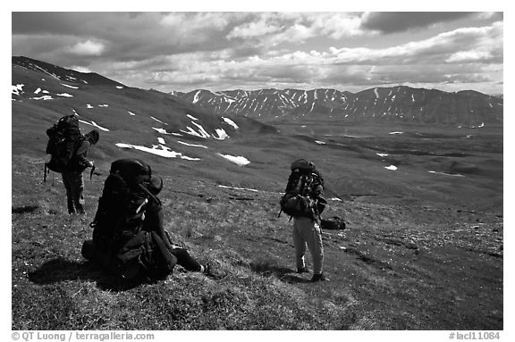 Backpackers take a pause when arriving on sight of Twin Lakes. Lake Clark National Park, Alaska
