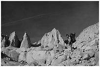 Woman with backpack hiking at the base of Mt Whitney. Sequoia National Park, California (black and white)